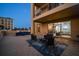 Private patio with comfortable seating and rug at 470 Mandalay Ave # 305, Clearwater Beach, FL 33767
