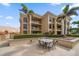 Ground level patio with a table and chairs at 470 Mandalay Ave # 305, Clearwater Beach, FL 33767