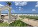 Relaxing patio overlooking the beach with lounge chairs at 470 Mandalay Ave # 305, Clearwater Beach, FL 33767