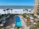 Luxury beachfront pool with ocean views and lounge area at 470 Mandalay Ave # 305, Clearwater Beach, FL 33767