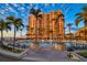 Evening view of resort-style pool with building backdrop at 470 Mandalay Ave # 305, Clearwater Beach, FL 33767