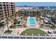 Resort-style pool with lounge chairs at 470 Mandalay Ave # 305, Clearwater Beach, FL 33767