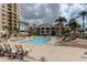 Inviting pool area with lounge chairs at 470 Mandalay Ave # 305, Clearwater Beach, FL 33767