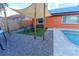 Relaxing backyard patio area with shade sail, fire pit, and artificial turf at 4740 Meadowsweet Ct, New Port Richey, FL 34653