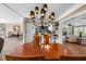 Elegant dining room with a wood table and chandelier, open to kitchen at 5166 39Th S St, St Petersburg, FL 33711