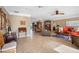Bright living room with tile floors, ceiling fan, and comfortable seating at 5166 39Th S St, St Petersburg, FL 33711