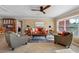 Living room with large windows, hardwood floors, and comfortable seating at 5166 39Th S St, St Petersburg, FL 33711
