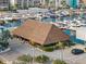 Thatched-roof tiki bar with outdoor seating at 5166 39Th S St, St Petersburg, FL 33711