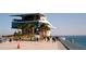 Modern waterfront building with pedestrian walkway and ocean views at 5166 39Th S St, St Petersburg, FL 33711