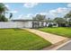 Charming mid-century modern home with a well-manicured lawn at 5900 35Th N Ave, St Petersburg, FL 33710