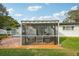 Outdoor screened patio with seating and fire pit feature at 5900 35Th N Ave, St Petersburg, FL 33710