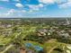 Resort-style community with tennis courts, golf course, and lush landscaping at 5950 Pelican Bay S Plz # 306, Gulfport, FL 33707