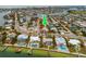 Property location shown with green arrow in aerial view at 601 Ambassador Ln, Holmes Beach, FL 34217