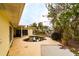 Property features a kidney-shaped pool needing attention, situated beside the house at 601 Ambassador Ln, Holmes Beach, FL 34217