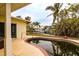 Features a kidney-shaped pool needing attention, situated beside the house at 601 Ambassador Ln, Holmes Beach, FL 34217