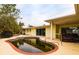 Property features a kidney-shaped pool needing attention, situated beside the house at 601 Ambassador Ln, Holmes Beach, FL 34217