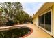Features a kidney-shaped pool needing attention, situated beside the house at 601 Ambassador Ln, Holmes Beach, FL 34217