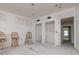 Unfinished bedroom with new drywall and two barstools at 601 Ambassador Ln, Holmes Beach, FL 34217