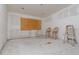 Simple bedroom under renovation, one wall with plywood at 601 Ambassador Ln, Holmes Beach, FL 34217