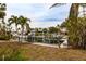 Private boat dock with lift in a tropical setting at 601 Ambassador Ln, Holmes Beach, FL 34217