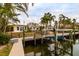 Wooden dock with boat lift and canal access at 601 Ambassador Ln, Holmes Beach, FL 34217
