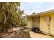 Side of house with storm damage and debris at 601 Ambassador Ln, Holmes Beach, FL 34217