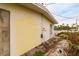 Side of house showing damage and debris at 601 Ambassador Ln, Holmes Beach, FL 34217