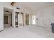 Unfinished living room with new doorway and access to other rooms at 601 Ambassador Ln, Holmes Beach, FL 34217