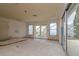 Large living room under renovation with new windows and doors at 601 Ambassador Ln, Holmes Beach, FL 34217