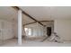 Under construction living room with exposed beams and new windows at 601 Ambassador Ln, Holmes Beach, FL 34217