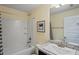 Bathroom with tub, shower, vanity, and granite countertop at 6069 Newmark St, Spring Hill, FL 34606