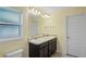 Double vanity bathroom with granite countertop at 6069 Newmark St, Spring Hill, FL 34606