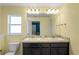 Double vanity bathroom with granite countertop at 6069 Newmark St, Spring Hill, FL 34606