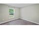 Bright bedroom with neutral walls and carpet at 6069 Newmark St, Spring Hill, FL 34606