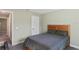 Bedroom with double bed, wood headboard, and gray bedding at 6069 Newmark St, Spring Hill, FL 34606