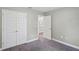 Bedroom with double doors and carpet flooring at 6069 Newmark St, Spring Hill, FL 34606