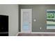 Bedroom with door leading to exterior at 6069 Newmark St, Spring Hill, FL 34606