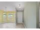 Entryway with yellow and green walls and tile flooring at 6069 Newmark St, Spring Hill, FL 34606