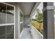 Long front porch with white railings and windows at 6069 Newmark St, Spring Hill, FL 34606