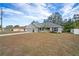 Newly built home with a gray exterior, visible garage and porch at 6069 Newmark St, Spring Hill, FL 34606