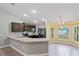 Modern kitchen with stainless steel appliances and granite counters at 6069 Newmark St, Spring Hill, FL 34606
