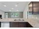 Kitchen features granite countertops and double sink at 6069 Newmark St, Spring Hill, FL 34606