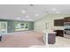 Open kitchen with granite countertops and dark cabinets at 6069 Newmark St, Spring Hill, FL 34606