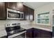 Stainless steel appliances in this modern kitchen at 6069 Newmark St, Spring Hill, FL 34606