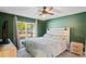 Main bedroom with large bed and backyard view at 6069 Newmark St, Spring Hill, FL 34606