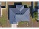 An aerial view of a house showcasing its gray asphalt shingle roof at 6069 Newmark St, Spring Hill, FL 34606