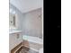 Clean bathroom with hexagon tile and a bathtub at 6811 S Himes Ave, Tampa, FL 33611