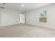 Bright bedroom featuring neutral carpeting and window with blinds at 7220 Swartburg Rd, North Port, FL 34291