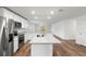 Modern kitchen with white cabinets, granite countertops and stainless steel appliances at 7220 Swartburg Rd, North Port, FL 34291