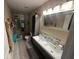 Double vanity bathroom with a large walk in shower at 8431 Edgewater Place Blvd, Tampa, FL 33615